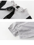 spring and summer new Korean version of the black fake two-piece strap bow dress